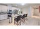 Beautiful kitchen featuring white cabinets, stainless steel appliances, and a breakfast bar at 326 Zenith Crest St, Henderson, NV 89015