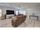 Open-concept living space with lots of light, decor, and modern ceiling fan at 326 Zenith Crest St, Henderson, NV 89015