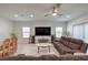 Large living room and dining room with lots of seating, decor and updated floors at 326 Zenith Crest St, Henderson, NV 89015