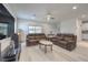 Spacious living room with light wood floors and two large sofas, plenty of natural light at 326 Zenith Crest St, Henderson, NV 89015