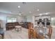 Spacious living and dining area features modern furnishings and decor with light flooring at 326 Zenith Crest St, Henderson, NV 89015