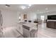 Bright and airy living space showcasing the open floor plan with modern kitchen at 326 Zenith Crest St, Henderson, NV 89015