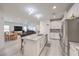 Open-concept living space with a modern kitchen, dining area, and comfortable living room at 326 Zenith Crest St, Henderson, NV 89015