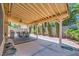 Outdoor patio area shaded by a pergola, furnished with a glass-top table and six metal chairs at 333 Abbington St, Henderson, NV 89074