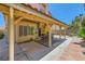 Exterior backyard patio with a pergola, lush greenery, and a barbecue grill, perfect for outdoor gatherings at 333 Abbington St, Henderson, NV 89074