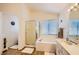 Bright bathroom with a standalone shower and a separate bathtub with a window at 333 Abbington St, Henderson, NV 89074