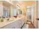 Bathroom featuring double sinks with white counters, with a doorway view into the adjacent shower at 333 Abbington St, Henderson, NV 89074