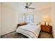 Bedroom featuring a ceiling fan and two windows with shutters at 333 Abbington St, Henderson, NV 89074
