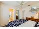 Bedroom with ceiling fan, dresser, mirror and access to a bathroom at 333 Abbington St, Henderson, NV 89074
