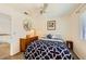 Cozy bedroom with ceiling fan, dresser and a mirror with a decorated frame at 333 Abbington St, Henderson, NV 89074