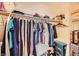 Walk-in closet with shelving and hanging racks for efficient storage at 333 Abbington St, Henderson, NV 89074