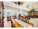 Formal dining room featuring tile flooring, a large window, mirrored accents, and direct access to the living room at 333 Abbington St, Henderson, NV 89074