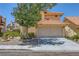 Charming two-story home with a well-maintained front yard and a two-car garage at 333 Abbington St, Henderson, NV 89074