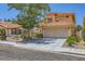 Charming two-story home with a well-maintained front yard and a two-car garage at 333 Abbington St, Henderson, NV 89074