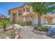 Charming two-story home with a well-maintained front yard and a two-car garage at 333 Abbington St, Henderson, NV 89074