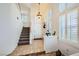 Inviting foyer with tile flooring, a staircase, and plenty of natural light at 333 Abbington St, Henderson, NV 89074