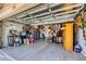 Spacious two car garage interior full of tools, storage items, and household equipment at 333 Abbington St, Henderson, NV 89074