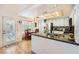 Well-lit eat-in kitchen with granite countertops, stainless steel appliances, tile backsplash, and access to the patio at 333 Abbington St, Henderson, NV 89074