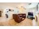 Inviting living room featuring tile floors, a comfortable leather sectional, and bright, natural light at 333 Abbington St, Henderson, NV 89074