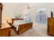 Spacious main bedroom with a ceiling fan, large windows, and a plush carpet at 333 Abbington St, Henderson, NV 89074