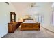 Neutral-toned main bedroom featuring plush carpeting, wood furniture, and a bright ceiling fan at 333 Abbington St, Henderson, NV 89074