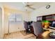 Home office with two desks, neutral paint, and a window providing natural light at 333 Abbington St, Henderson, NV 89074