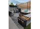 Inviting backyard patio with ample seating, fire pit, stylish pavers, and privacy fencing at 3601 Slapton Ave, North Las Vegas, NV 89031