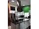Spacious kitchen with island, stainless steel appliances, and bright overhead lighting at 3601 Slapton Ave, North Las Vegas, NV 89031