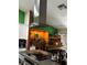Open kitchen featuring modern stainless-steel range hood and custom wood bar at 3601 Slapton Ave, North Las Vegas, NV 89031