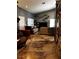 Spacious living room featuring high ceilings, custom flooring, and a modern cat climbing wall at 3601 Slapton Ave, North Las Vegas, NV 89031