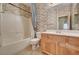 Cozy bathroom with standard tub, integrated shower, and wood vanity at 3609 Blue Pimpernel Ave, North Las Vegas, NV 89081