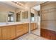 Bathroom features dual vanities, a large mirror, and a spacious walk-in closet at 3609 Blue Pimpernel Ave, North Las Vegas, NV 89081