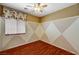 Bedroom featuring hardwood floors, neutral paint, and a ceiling fan at 3609 Blue Pimpernel Ave, North Las Vegas, NV 89081