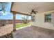 This inviting covered patio features a ceiling fan and overlooks a low-maintenance backyard at 3609 Blue Pimpernel Ave, North Las Vegas, NV 89081