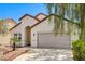 Charming single-story home featuring a two-car garage and desert landscaping at 3609 Blue Pimpernel Ave, North Las Vegas, NV 89081