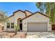 Charming single-story home featuring a two-car garage and desert landscaping at 3609 Blue Pimpernel Ave, North Las Vegas, NV 89081