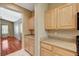 Kitchen with granite countertops and light wood cabinets opens to the living room at 3609 Blue Pimpernel Ave, North Las Vegas, NV 89081