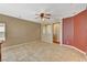 Open living room with tile flooring and neutral color palette at 3609 Blue Pimpernel Ave, North Las Vegas, NV 89081