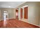 Open-concept living room with hardwood floors and neutral paint at 3609 Blue Pimpernel Ave, North Las Vegas, NV 89081
