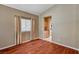 Inviting living room with wood floors and large window at 3609 Blue Pimpernel Ave, North Las Vegas, NV 89081