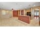 Bright open-concept living space with tile flooring and breakfast bar at 3609 Blue Pimpernel Ave, North Las Vegas, NV 89081