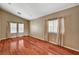 Spacious living room with wood floors and ample natural light at 3609 Blue Pimpernel Ave, North Las Vegas, NV 89081