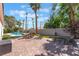 Outdoor space with a brick patio, lounge chairs, and a pool, perfect for relaxation and entertainment at 4116 Villa Flora St, Las Vegas, NV 89130