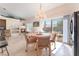 Bright dining area with chandelier, fireplace, and sliding doors to outdoor patio at 4116 Villa Flora St, Las Vegas, NV 89130