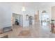 Open foyer featuring high ceilings, elegant chandelier, tile flooring, and intricate wall details at 4116 Villa Flora St, Las Vegas, NV 89130