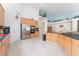 Large kitchen features light wood cabinets, stainless steel appliances, a cooktop, and a large breakfast area at 4116 Villa Flora St, Las Vegas, NV 89130