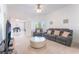 Bright living room with contemporary furnishings, neutral colors, and an open layout for comfortable living at 4116 Villa Flora St, Las Vegas, NV 89130