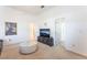 Bright living room with neutral colors and a decorative glass coffee table at 4116 Villa Flora St, Las Vegas, NV 89130