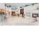Inviting living room with a fireplace, decorative ledges, and tiled flooring at 4116 Villa Flora St, Las Vegas, NV 89130