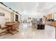 Open-concept kitchen and living area with tile flooring and bright, natural light at 4116 Villa Flora St, Las Vegas, NV 89130